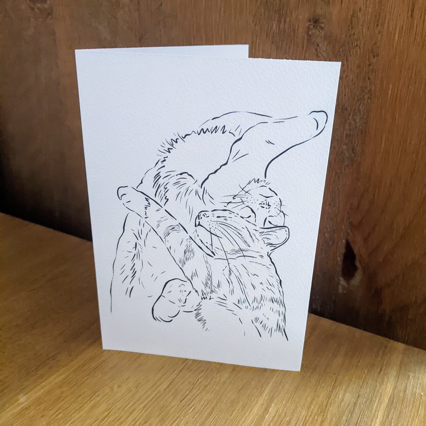 Line Art Cuddling Cat Greetings Card